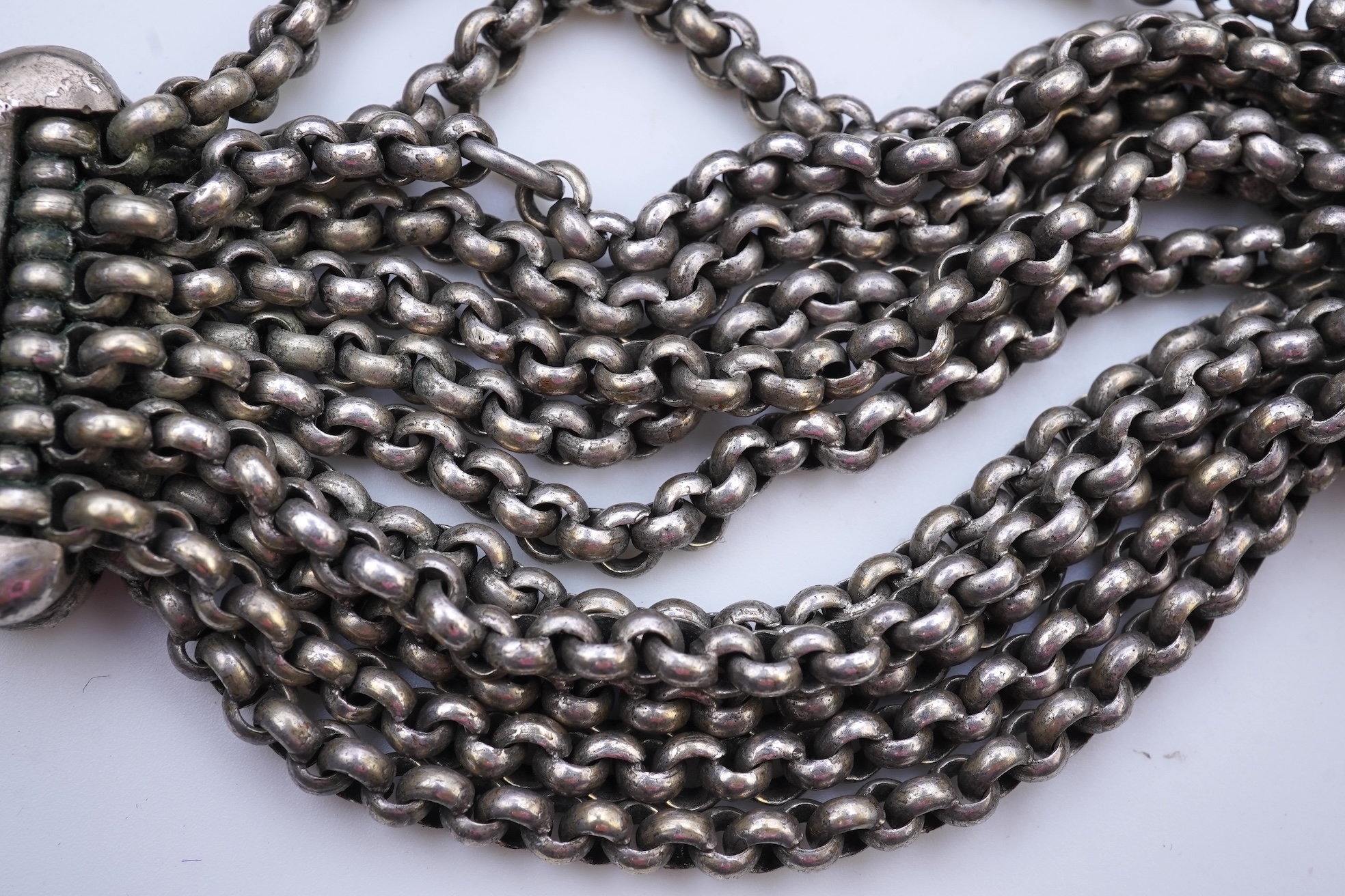 A chatelaine and a pair of serpentine bead earrings